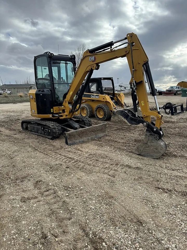 Cat 303 mini excavator with enclosed cab.